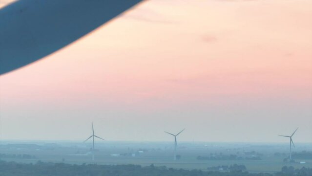 Aerial Ohio Farmland with Wind Turbines at Dusk