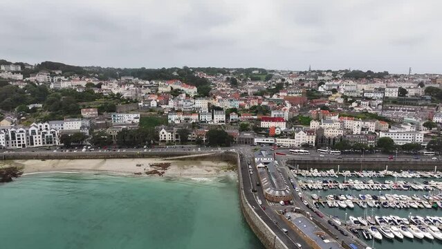 St. Peter Port, Guernsey, Channel Islands. Aerial View of Harbor, Buildings and Coastal Traffic