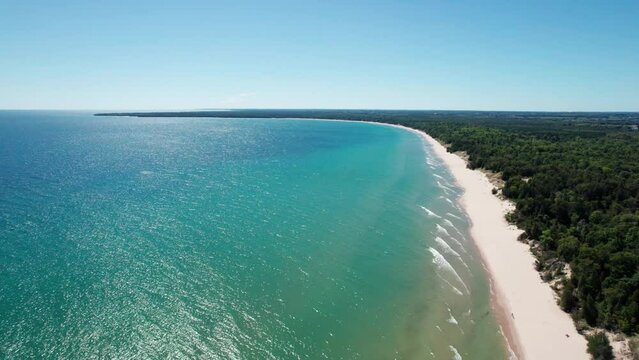 Drone shot panning to the left of whitefish dunes state park in door county, Wisconsin