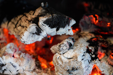View of burnt wood in wood stove.