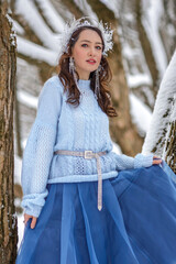 Princess Snow White in the winter forest. Fairy-tale character in bright outfits. A sweet and...