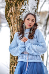 Princess Snow White in the winter forest. Fairy-tale character in bright outfits. A sweet and...