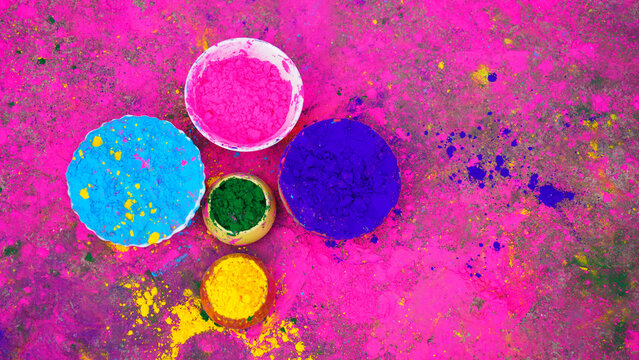 Indian cute happy child celebrate Indian holi festival with colorful paint powder on faces and body