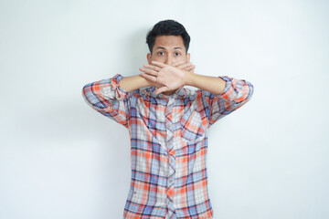 Photo portrait of scared man covering mouth with two hands isolated on white background