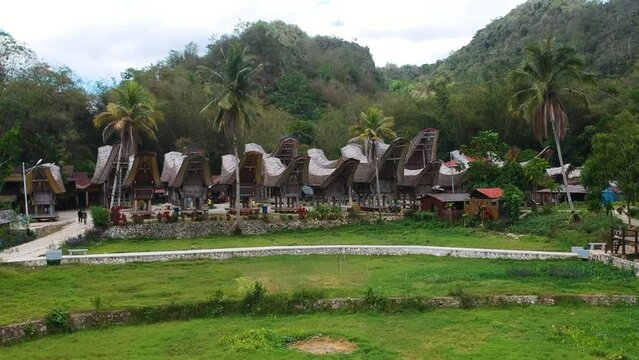Aerial of traditional Torajan village Kete Kesu and UNESCO World Heritage Site with grave site and Tongonan buildings in Tana Toraja, South Sulawesi, Indonesia.