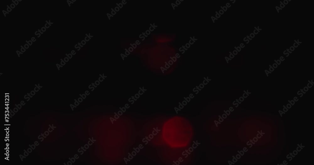 Poster fast blinking red light bokeh effect on black background