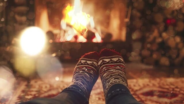 feet in wool socks near fireplace in winter time. seamless looping overlay 4k virtual video animation background
