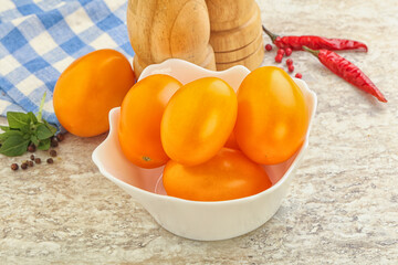 Sweet ripe yellow tomato in the bowl