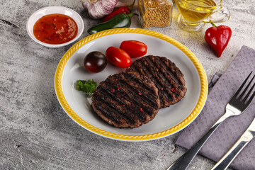 Grilled burger cutlet with sauce