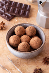 Chocolate truffle candies sprinkled with cocoa. Dessert. Vegetarian food.