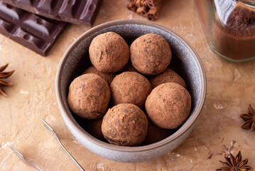Chocolate truffle candies sprinkled with cocoa. Dessert. Vegetarian food.