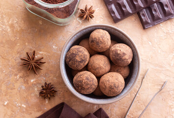 Chocolate truffle candies sprinkled with cocoa. Dessert. Vegetarian food.