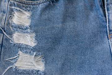 Close up blue Jean with hole torn, Ripped Destroyed  denim jean.