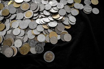 Many thai baht coins, Thai baht coins on black background.