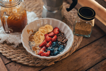 Oatmeal topped with fruit Chocolate and bee pollen