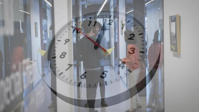 Animation of clock moving over diverse colleagues discussing work