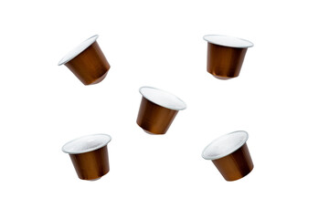 Capsules with black coffee for a coffee machine on a white background isolated