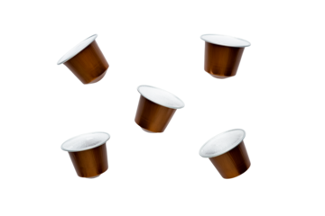 Capsules with black coffee for a coffee machine on a white background isolated