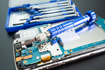 Repairing and upgrade Samsung mobile phone, electronic, computer hardware and technology concept.