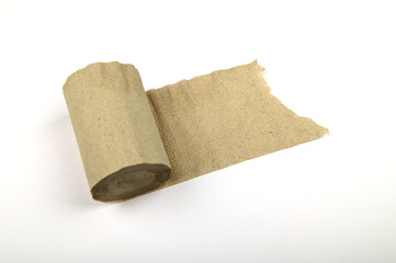 One roll of gray toilet paper unfolded on a white background.