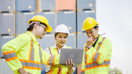 Group of professional dock worker and engineering people taking with their supervisor while record data online with digital laptop at warehouse logistic in cargo freight ship for import and export