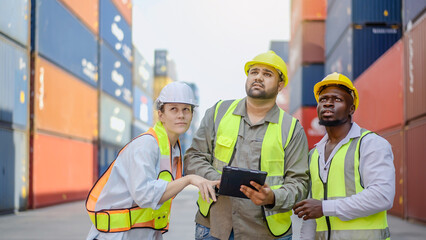 Group of professional dock worker and engineering people taking with their supervisor while record data online with digital connection tablet at Container cargo, Import and Export concept.