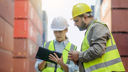 Two professional dock worker or engineering people discussing inventory lists with their supervisor while record data online with digital connection tablet at Container cargo, Import and Export