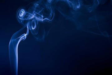 Fototapeta premium dark blue smoke flowing on minimal dark background