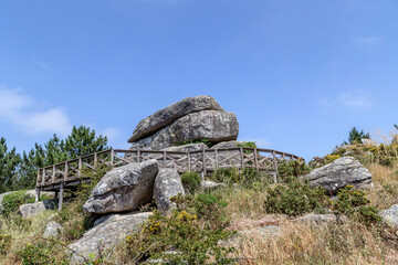 Fototapeta na wymiar Balancing rock from the Siradella viewpoint. O Grove, Galicia, Spain.