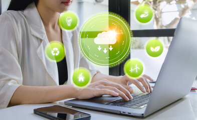 ESG business concept. Women use computer laptop to analyze environment social governance...