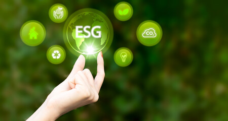 Hand of human holding green earth ESG icon for Environment Social and Governance, World sustainable environment concept.