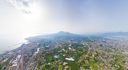 Pompeii, Naples, Italy. Ruins of an ancient city. View of the Visuvius volcano, the city and the sea. Summer, daytime. Aerial view