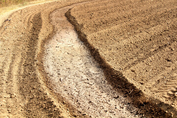 Close up of ploughed agriculture field of India for wheat crops. First steps to start wheat farming 