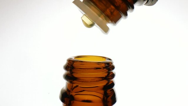 Drops of essential oils in bottles 