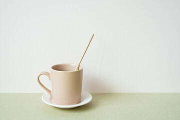Ceramic mug cup on table. white ivory background