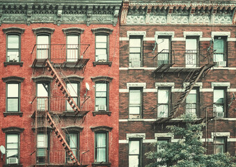 Old buildings with fire escapes, color toning applied, New York City, USA. - 753506802