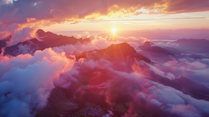 An aerial view of a spectacular sunset over the mountains, with spectacular clouds