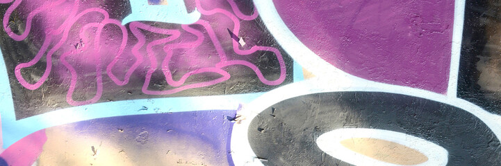 Colorful background of graffiti painting artwork with bright aerosol outlines on wall. Old school...