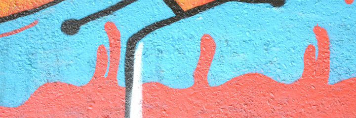 Colorful background of graffiti painting artwork with bright aerosol outlines on wall. Old school...