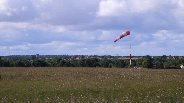 red and white windsock on  airfield