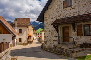 A street in the mountain village of Mione in Carnia, Friuli-Venezia Giulia, north east Italy - obrazy, fototapety, plakaty