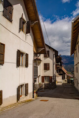Fototapeta na wymiar A street in the mountain village of Mione in Carnia, Friuli-Venezia Giulia, north east Italy