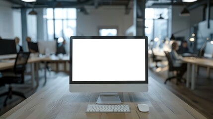 A blank white screen monitor mockup placed within the context of a contemporary office workspace background.