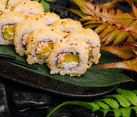 sushi rolls with mango and crab inside