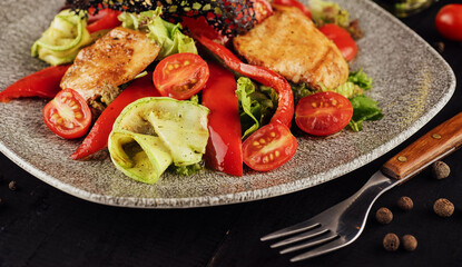 chicken salad with vegetables on a plate