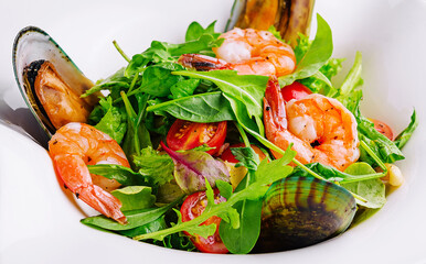 Seafood salad with shrimps and mussels on plate
