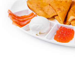 pancakes with red caviar and salmon and ice cream