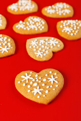 beautiful hand-baked cookies in the shape of a heart on a red background
