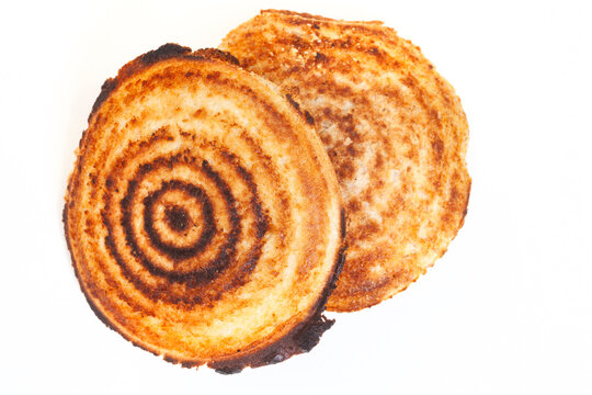 Jaffle, an old school toasted sandwich, filled with savory mince. Isolated on white with copy space