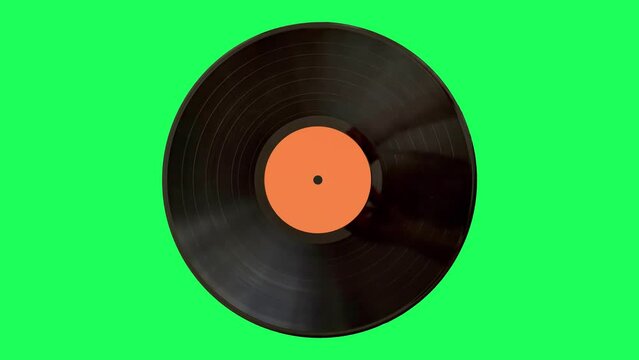LP old vinyl record spinning on the green screen. Top view.